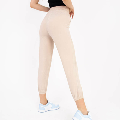 Pantaloni de damă din țesătură bej cu ecuson - Îmbrăcăminte