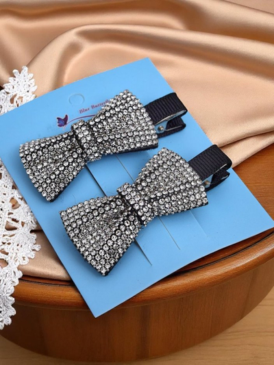 Royalfashion Set de 2 clame de păr cu fundițe și pietre strălucitoare Isadora