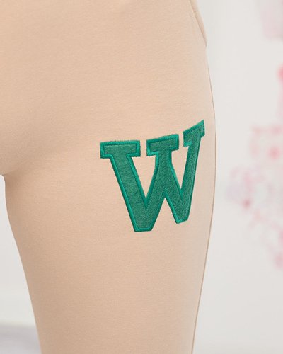 Pantaloni de trening de dama bej cu un petec colorat - Imbracaminte