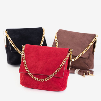 O mică geantă de mână maro închis pe un lanț - Genți de mână