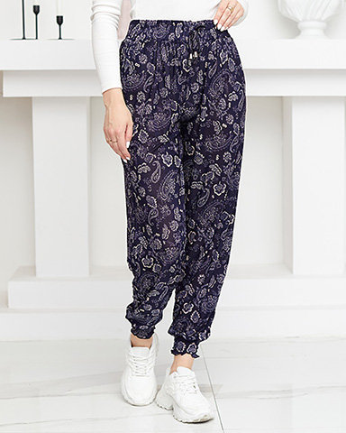 Pantaloni de damă bej și bleumarin cu imprimeu - Îmbrăcăminte