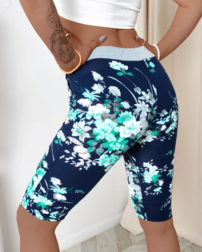 Pantaloni scurți de damă 3/4 bleumarin cu flori verzi PLUS SIZE - Îmbrăcăminte