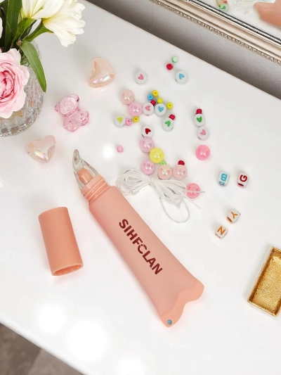 Luciu de buze cu brățară Gloss & Charm Cocoa Cookie