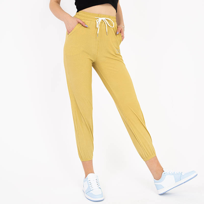 Pantaloni de damă din țesătură galbeni cu petice - Îmbrăcăminte