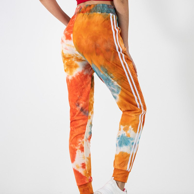 Pantaloni de trening portocalii cu dungi - Îmbrăcăminte