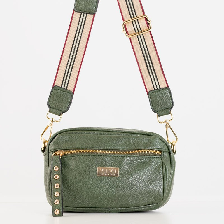 O geantă de mână mică pentru femei pe un cadru verde - Genți de mână