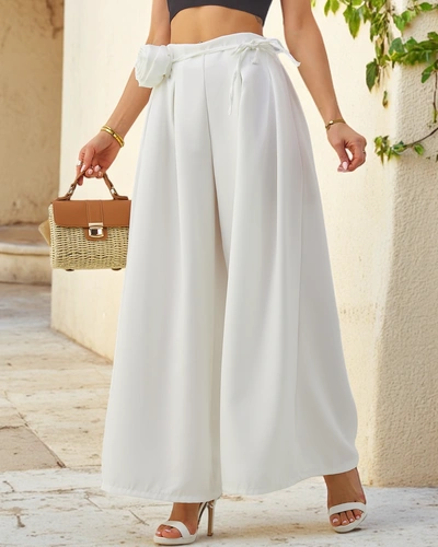 Pantaloni eleganți, largi pentru femei, cu o floare decorativă la brâu