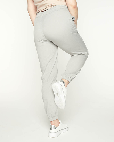 Pantaloni de jogging de damă gri din țesătură PLUS SIZE - Îmbrăcăminte