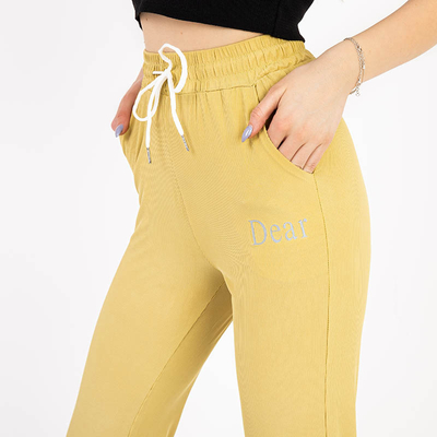 Pantaloni de damă din țesătură galbeni cu petice - Îmbrăcăminte