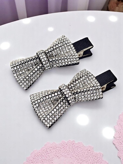 Royalfashion Set de 2 clame de păr cu fundițe și pietre strălucitoare Isadora