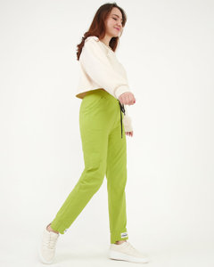 Pantaloni de damă din țesătură verde deschis cu petice - Îmbrăcăminte